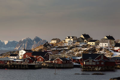 Scenic view of sea and buildings against sky