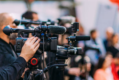 Group of cameras at an indoor event