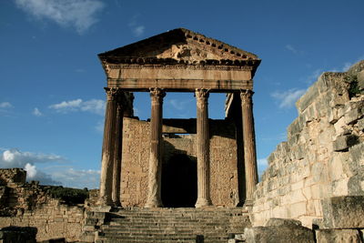 Old ruins against blue sky at dougga