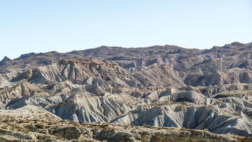 Scenic view of rocky mountains against clear sky