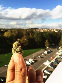 Cropped image of hand holding railing