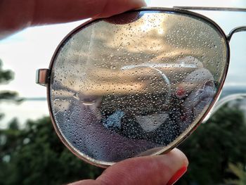 Cropped image of hand holding glass