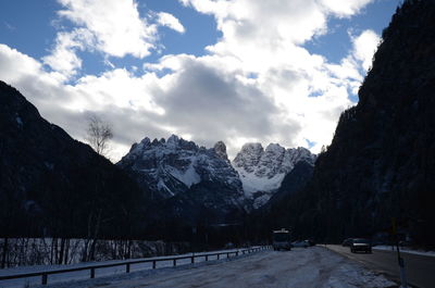 View of snowcapped mountain against cloudy sky