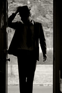 Man standing at doorway