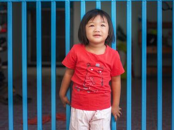 Portrait of cute girl standing outdoors