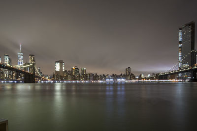 Illuminated city at waterfront