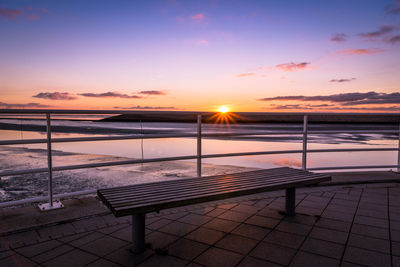 Empty bench against north sea
