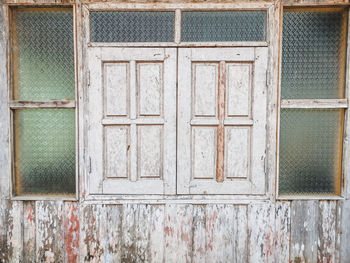 Full frame shot of closed window of old building