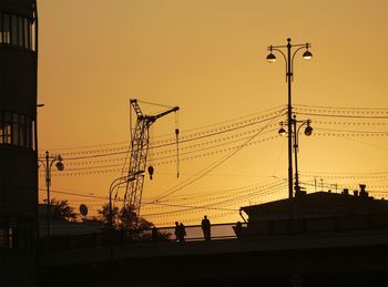 Low angle view of built structure at sunset