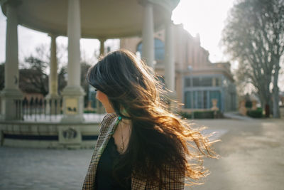 Beautiful woman standing in city