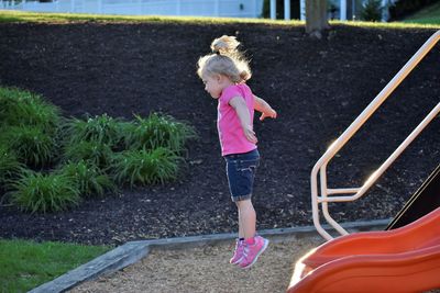 Side view of a girl standing in water