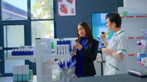 Portrait of smiling female friends standing in laboratory