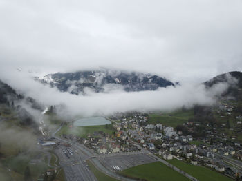 High angle view of city buildings against sky