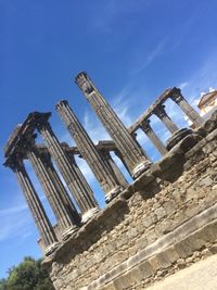 Low angle view of built structure against blue sky