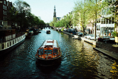 Boats sailing in canal