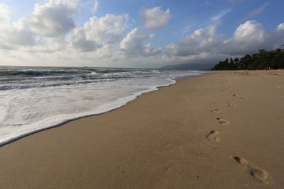 Scenic view of beach against sky