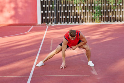 Full length of young woman running