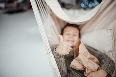 Portrait of cute boy on bed