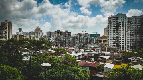 Skyscrapers in city against sky