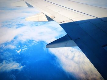 Airplane wing against sky