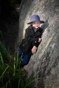 Portrait of man standing on rock