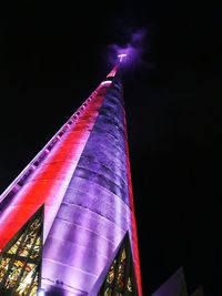 Low angle view of illuminated lights against sky at night