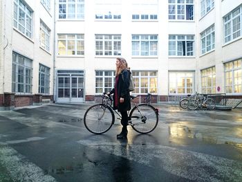 Full length of woman standing in city