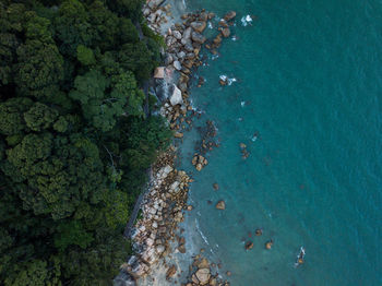 High angle view of rocks by sea