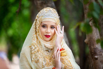 Woman in traditional clothing looking away