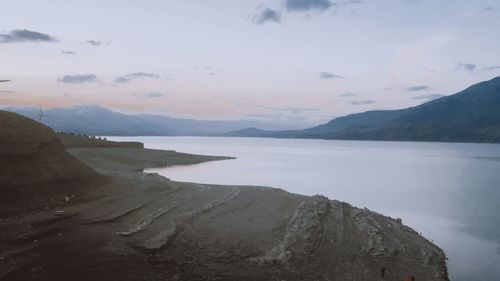 Scenic view of lake against sky during sunset