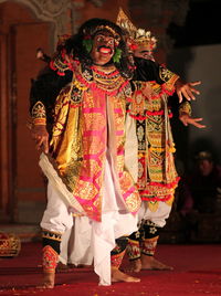 Man wearing costume on stage