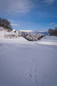 Scenic view of snowcapped mountains against sky