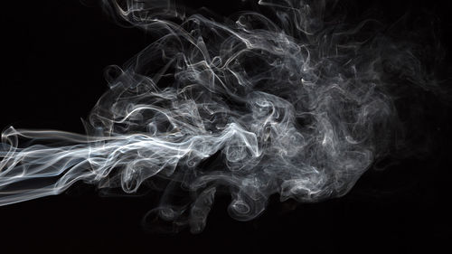 Close-up of smoke against black background