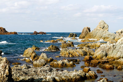 Scenic view of sea against cloudy sky