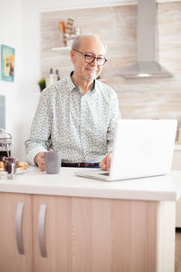 Man using laptop at home