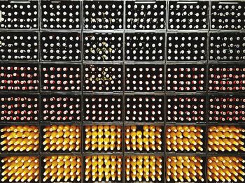 Full frame shot of drink bottles in racks