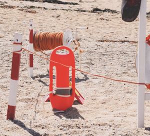 Close-up of red toy on sand