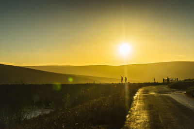 Scenic view of landscape against sky during sunset