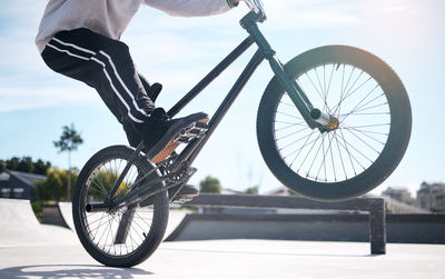 Low section of man riding bicycle