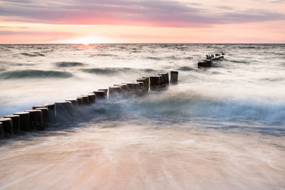 Scenic view of sea against romantic sky