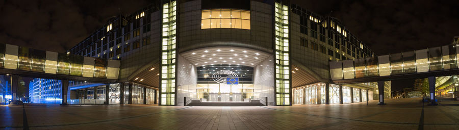 Illuminated modern buildings in city at night