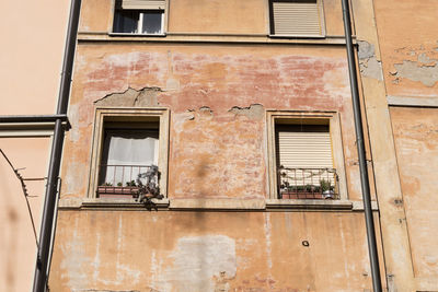 Low angle view of window on old building