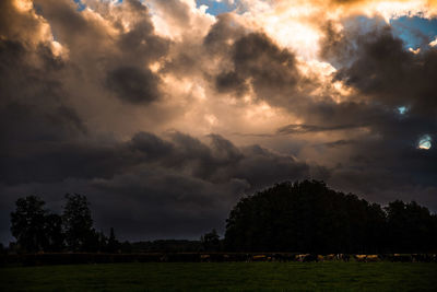 Scenic view of landscape against cloudy sky