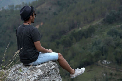 Side view of young man looking away