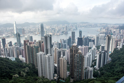 High angle view of modern buildings in city against sky