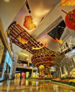 Low angle view of illuminated ferris wheel at store