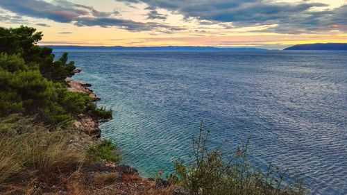 Scenic view of sea at sunset