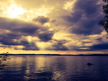 Scenic view of sea against cloudy sky