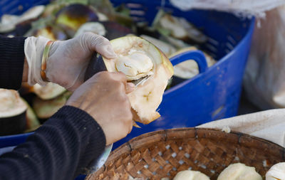 Close-up of hand holding ice cream at market