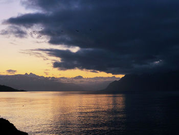 Scenic view of sea against sky at sunset